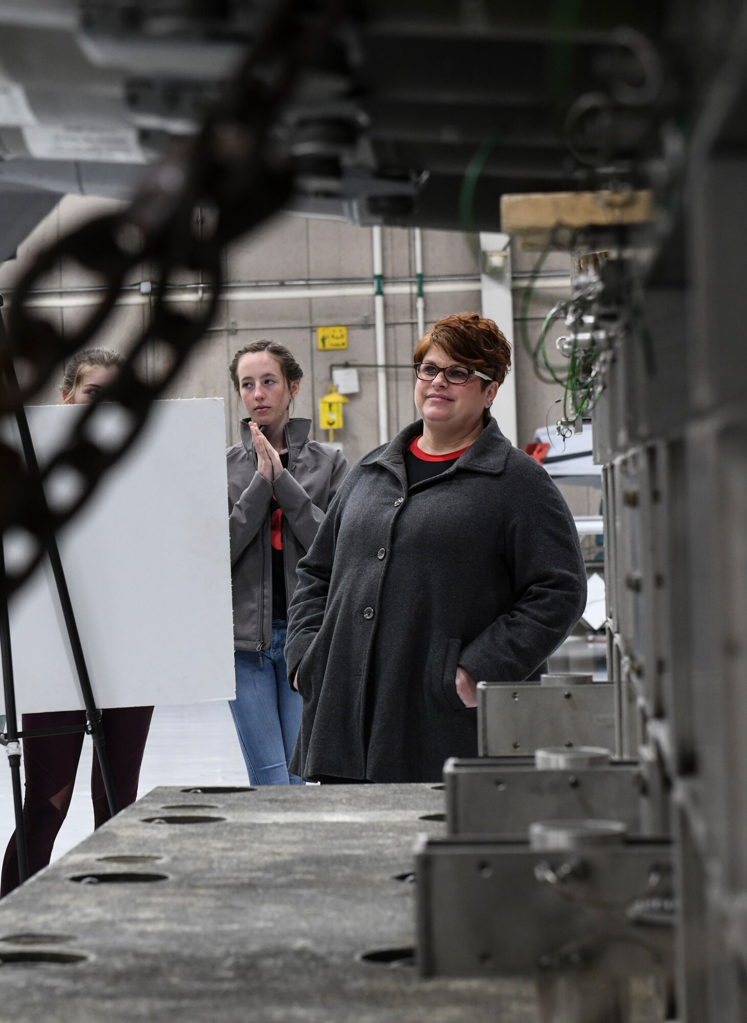 Stormy Taylor, a coordinator of the 2020 Community Leadership and Involvement Means a Better Community High (CLIMB High), listens to a weapons process brief during a CLIMB High tour at Whiteman Air Force Base, Mo., Jan. 29, 2020. The program began in 2007, since successfully graduating approximately 250 students. (U.S. Air Force photo by Staff Sgt. Sadie Colbert)