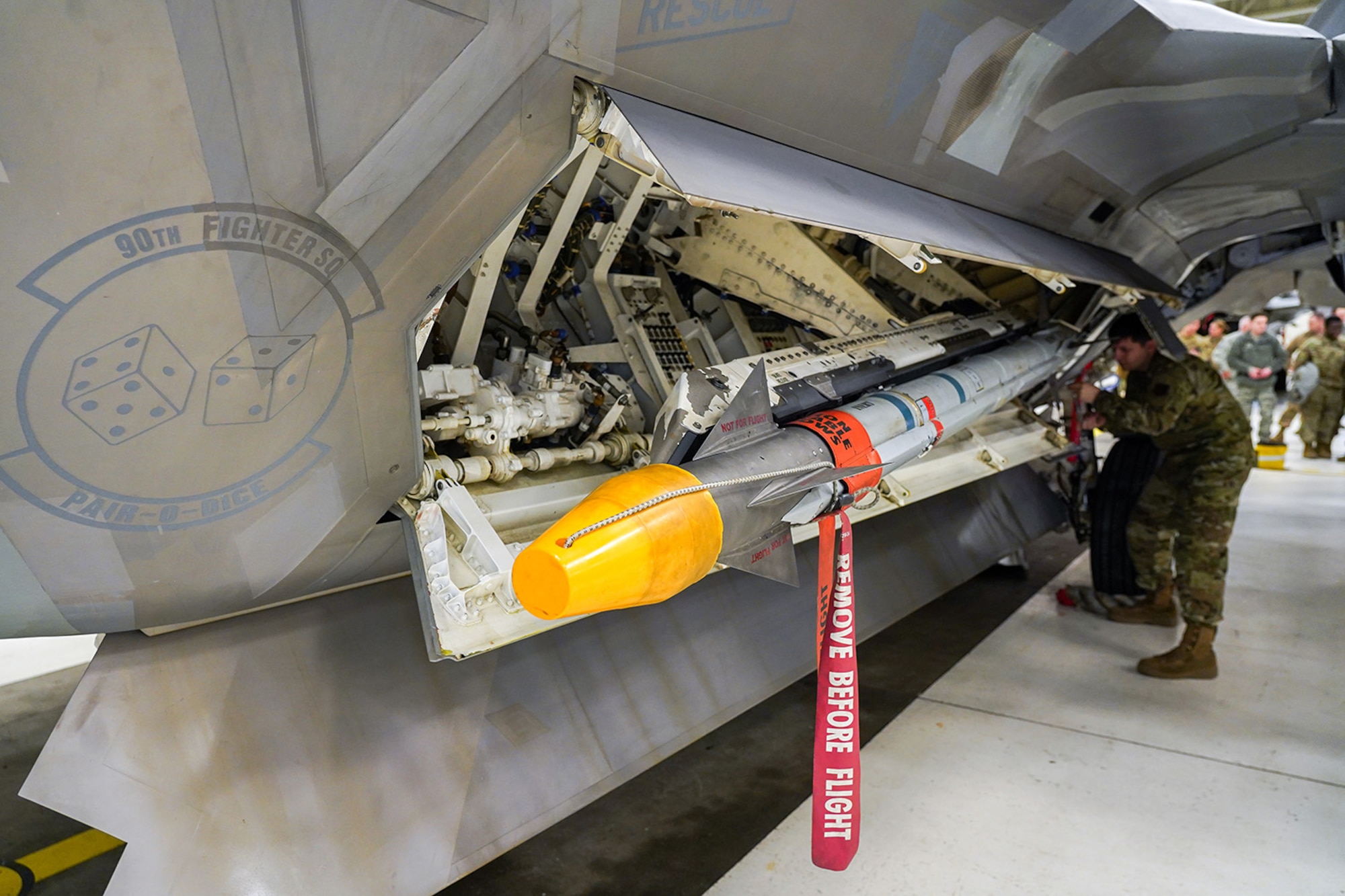 Airmen assigned to the 90th and 525th Aircraft Maintenance Units compete during a timed F-22 Raptor load crew competition on Joint Base Elmendorf-Richardson, Alaska, Jan. 31, 2020.