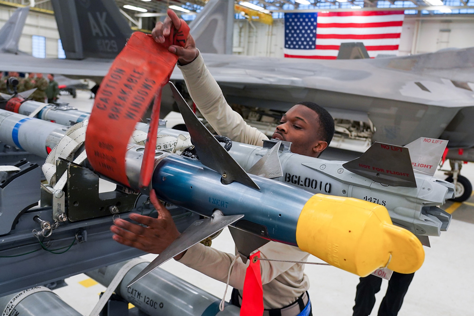 Airmen assigned to the 90th and 525th Aircraft Maintenance Units compete during a timed F-22 Raptor load crew competition on Joint Base Elmendorf-Richardson, Alaska, Jan. 31, 2020.