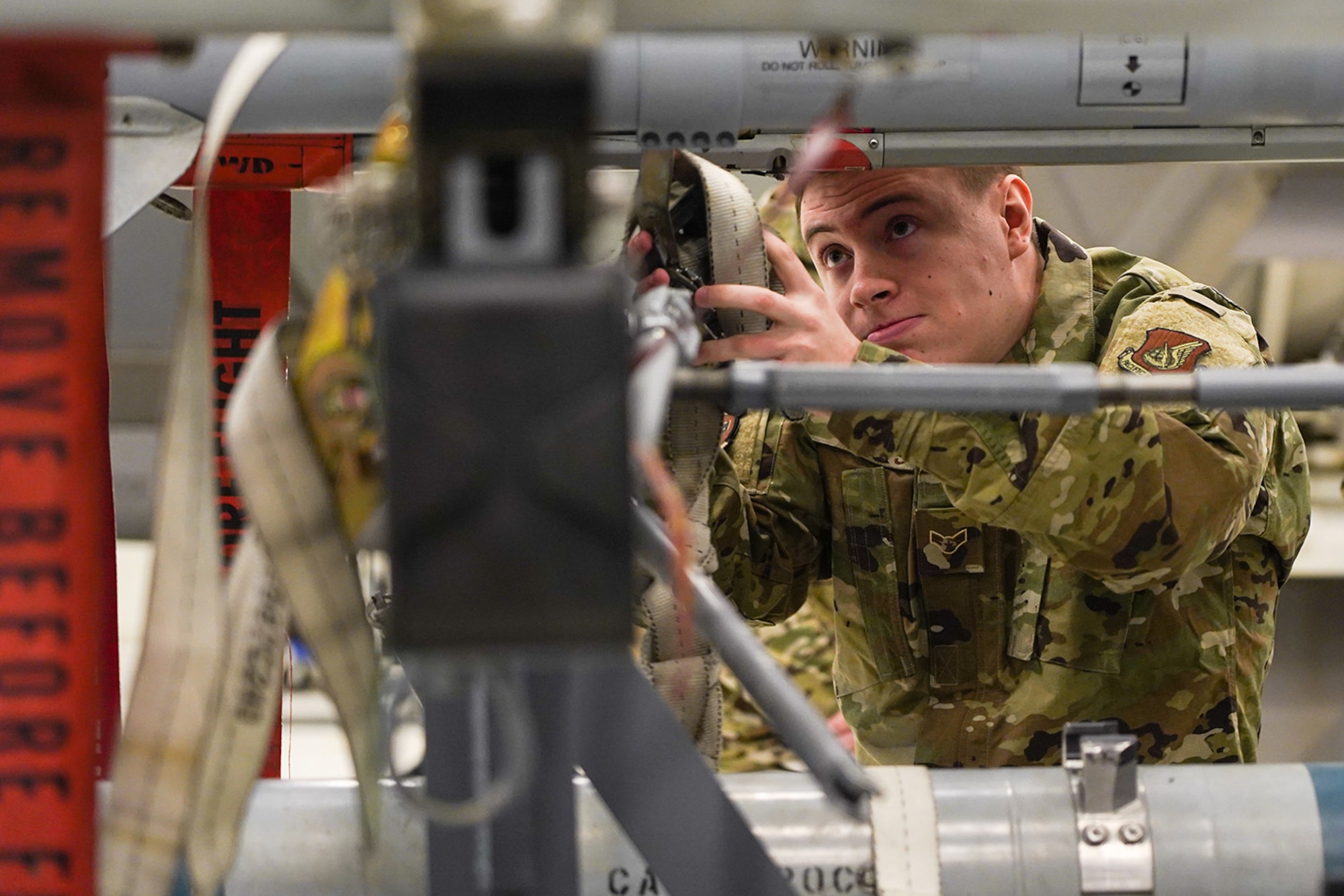 Airmen assigned to the 90th and 525th Aircraft Maintenance Units compete during a timed F-22 Raptor load crew competition on Joint Base Elmendorf-Richardson, Alaska, Jan. 31, 2020.