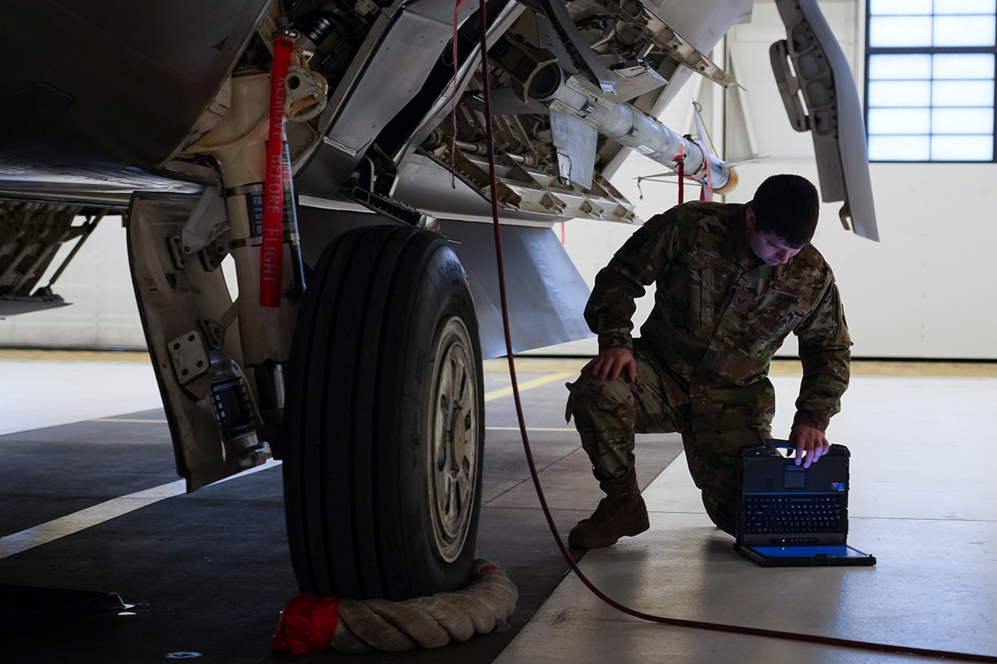 Airmen assigned to the 90th and 525th Aircraft Maintenance Units compete during a timed F-22 Raptor load crew competition on Joint Base Elmendorf-Richardson, Alaska, Jan. 31, 2020.