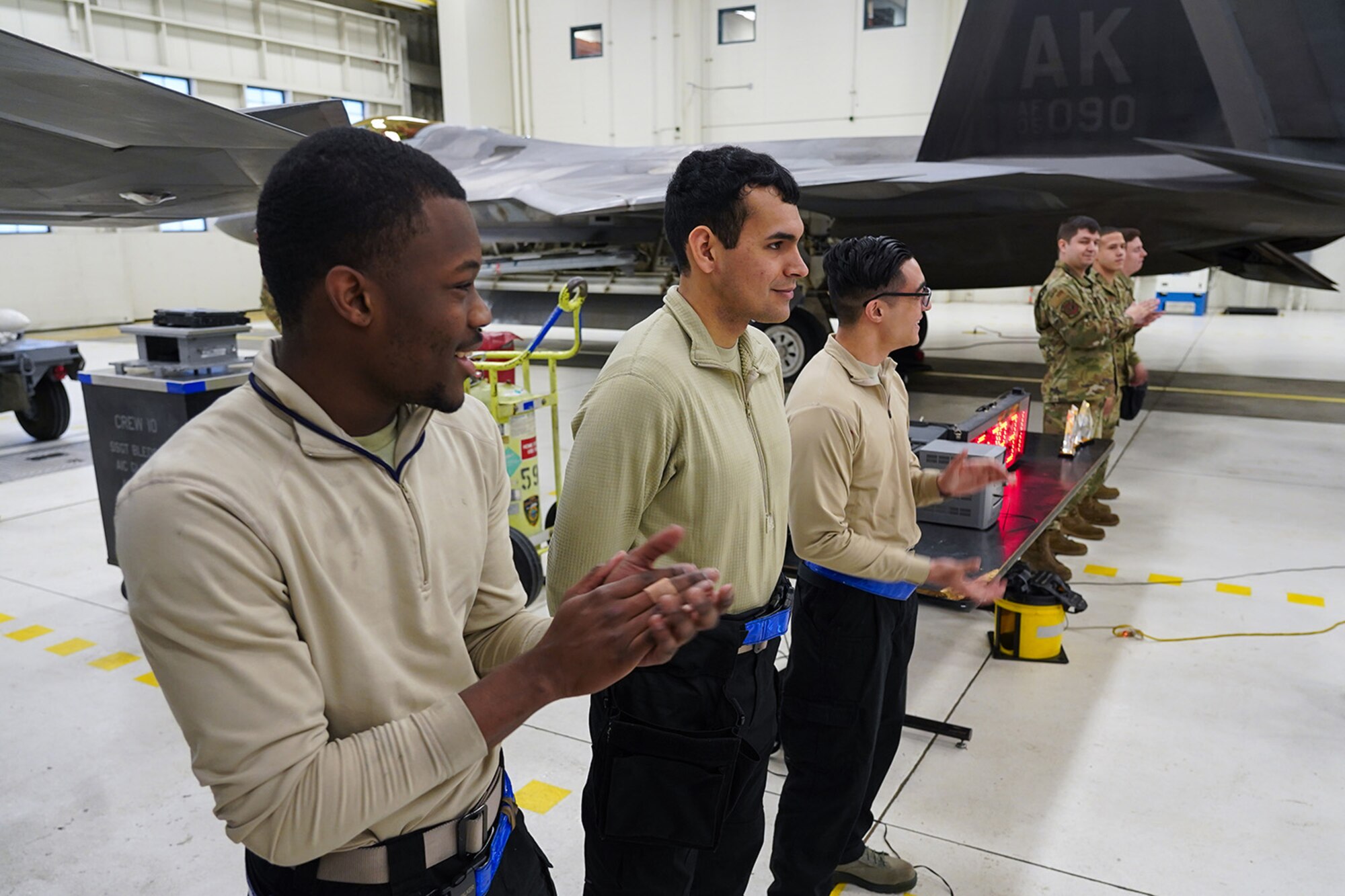 Airmen assigned to the 90th and 525th Aircraft Maintenance Units compete during a timed F-22 Raptor load crew competition on Joint Base Elmendorf-Richardson, Alaska, Jan. 31, 2020.