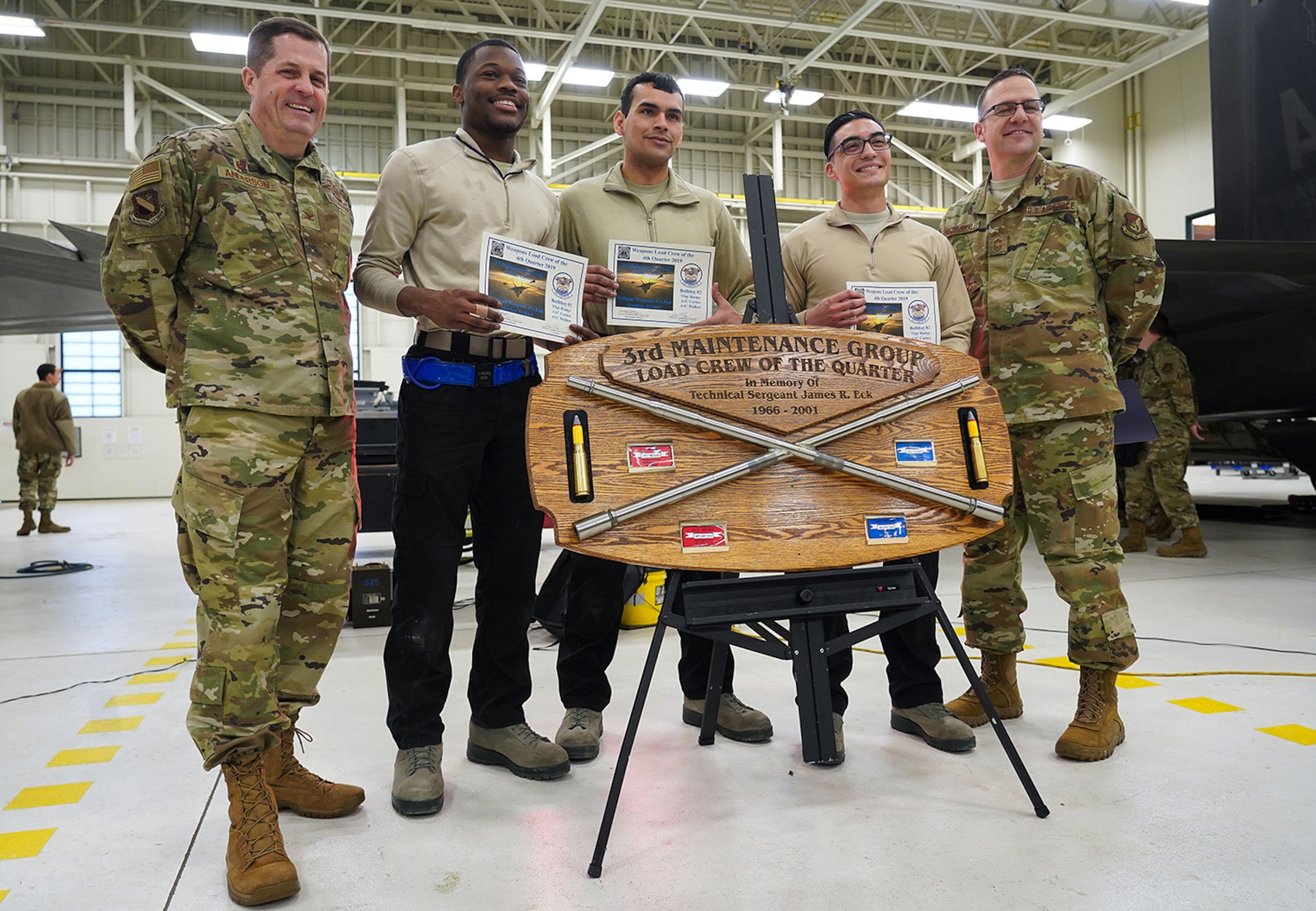 Airmen assigned to the 90th and 525th Aircraft Maintenance Units compete during a timed F-22 Raptor load crew competition on Joint Base Elmendorf-Richardson, Alaska, Jan. 31, 2020.