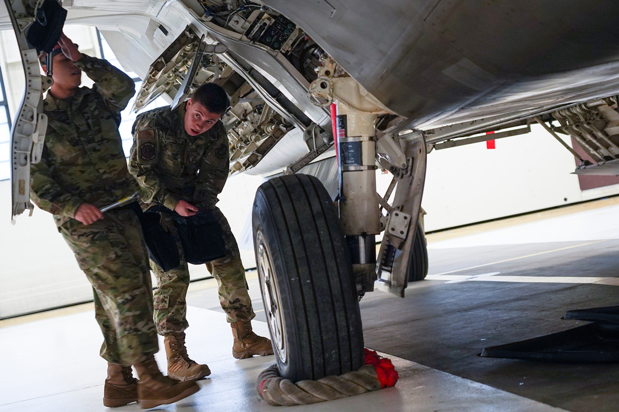 Airmen assigned to the 90th and 525th Aircraft Maintenance Units compete during a timed F-22 Raptor load crew competition on Joint Base Elmendorf-Richardson, Alaska, Jan. 31, 2020.