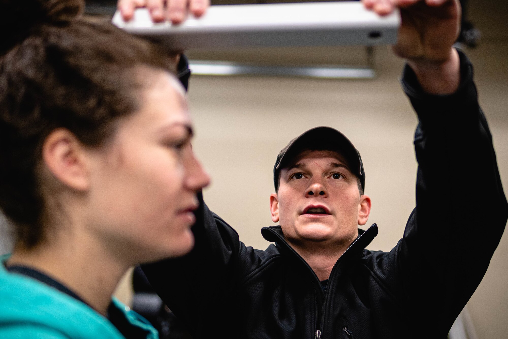 Chase Chesterman, 27th Special Operations Group Preservation of the Force and Families human performance dietician, measures the height of a volunteer at a human performance baseline test on Cannon Air Force Base, N.M., Jan. 30, 2020. The human performance baseline test is an Air Force Special Operations Command pilot test to determine the effectiveness of the new human performance program. (U.S. Air Force photo by Senior Airman Candin Muniz)