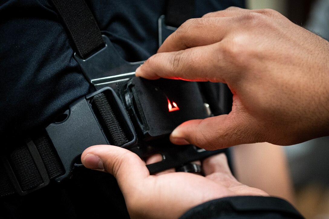 Karan Kanchan, Equilibrium by Vayu Tech founder and inventor, attaches a sensor to a volunteer at a human performance baseline test on Cannon Air Force Base, N.M., Jan. 30, 2020. The sensor allows researchers to detect weak areas in an airman's mobility during a human performance baseline test. The human performance baseline test is an Air Force Special Operations Command pilot test to determine the effectiveness of the new human performance program. (U.S. Air Force photo by Senior Airman Candin Muniz)