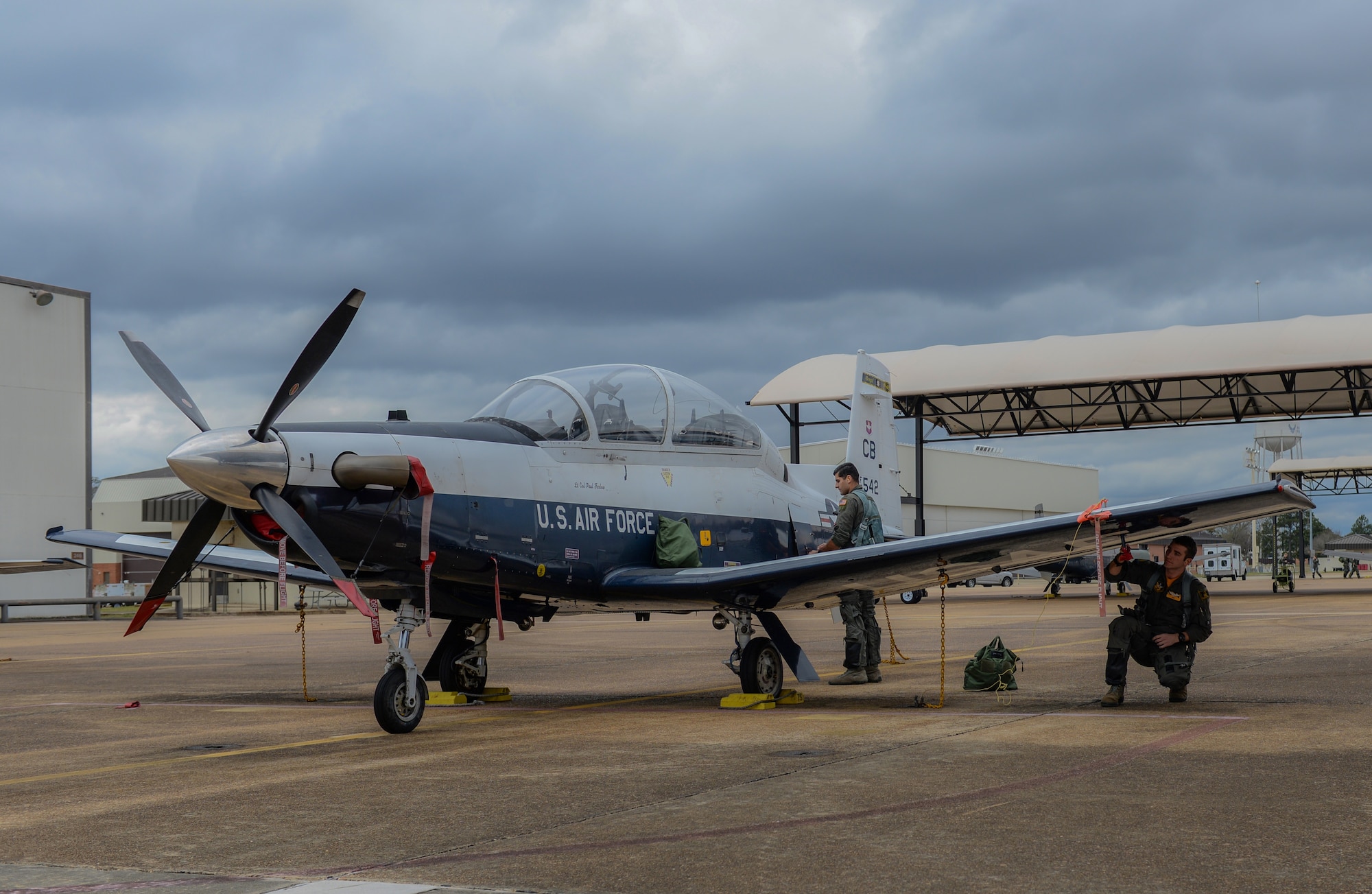 Second Lt. Rafael Galvoa, 37th Flying Training Squadron student pilot, and 1st Lt. Thomas Buckley, 37th FTS instructor pilot, conduct pre-flight checks on a T-6 Texan II, Jan. 24, 2020, at Columbus Air Force Base, Mississippi. Prior to becoming an instructor pilot, pilots must complete the Pilot Training Course at Randolph Air Force Base. (U.S. Air Force photo by Airman Davis Donaldson)