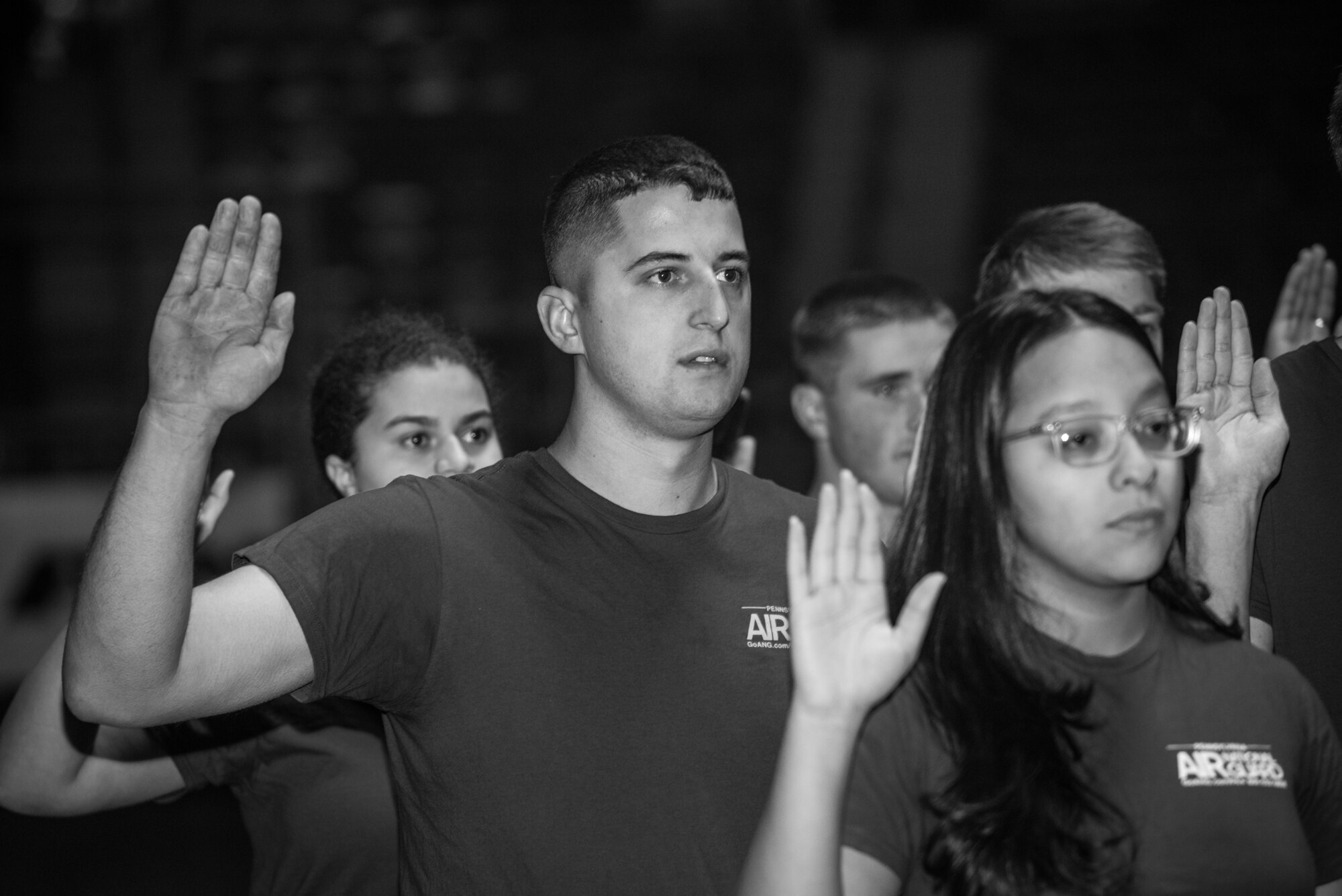 More than 60 U.S. Air Force and Army recruits recite the oath of enlistment during a mass-enlistment at the Pennsylvania Farm Show Jan. 9, 2020, in Harrisburg, Pennsylvania