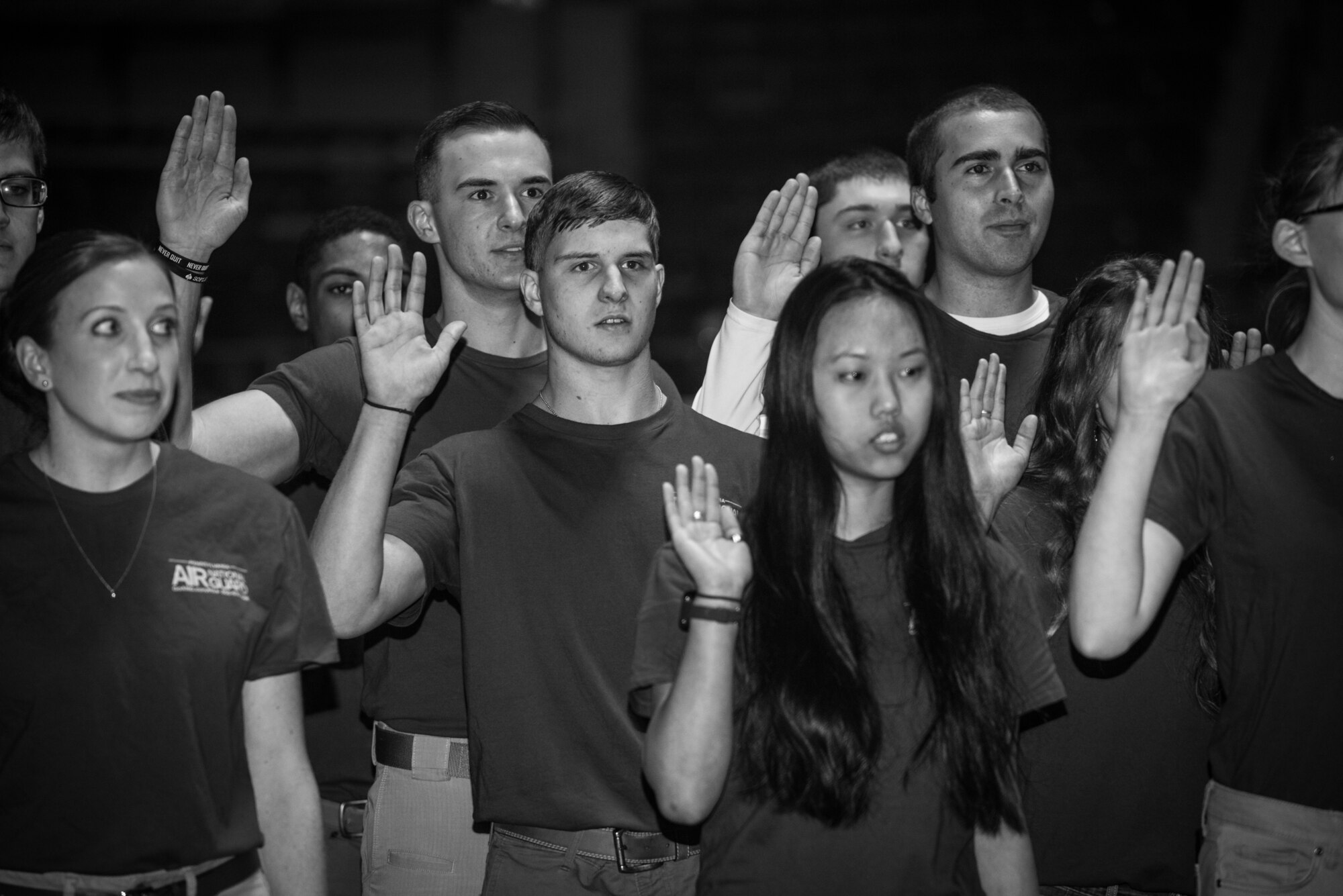 More than 60 U.S. Air Force and Army recruits recite the oath of enlistment during a mass-enlistment at the Pennsylvania Farm Show Jan. 9, 2020, in Harrisburg, Pennsylvania.