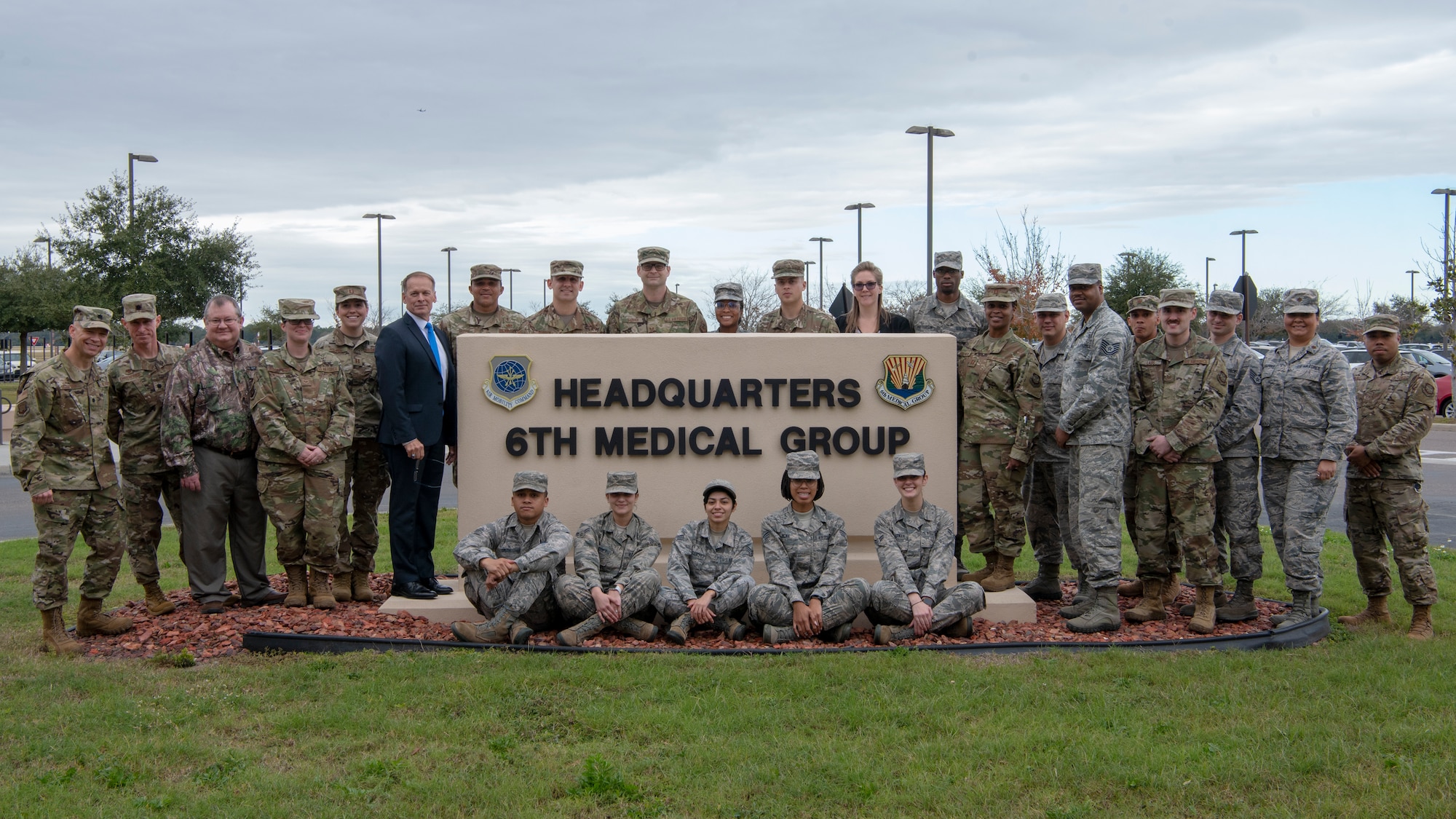The Biomedical Science Corps (BSC) team members pose around the 6th Medical Group headquarters sign at MacDill Air Force Base, Fla. Jan 27, 2020. The roots of the BSC date to 1917 with the Army Sanitary Corps and was established within the Air Force Medical Service in 1965 to help provide oversight of the scientific and engineering elements of medical care. (U.S. Air Force photo by Airman First Class David D. McLoney)