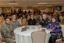 Awardees (from left to right) Sgt. Jeffrey Xochicale, Noncommissioned Officer of the Year, Lance Cpl. Noah Avila, Marine of the Year, Reah Andrews, Employee of the Quarter, Ryan Tworek, Supervisor of the Year, and Ruby Adams, Employee of the Quarter, sit together before the quarterly awards breakfast begins aboard Marine Corps Logistics Base Barstow, Calif., Jan. 28. (U.S. Marine Corps photo by Jack J. Adamyk)