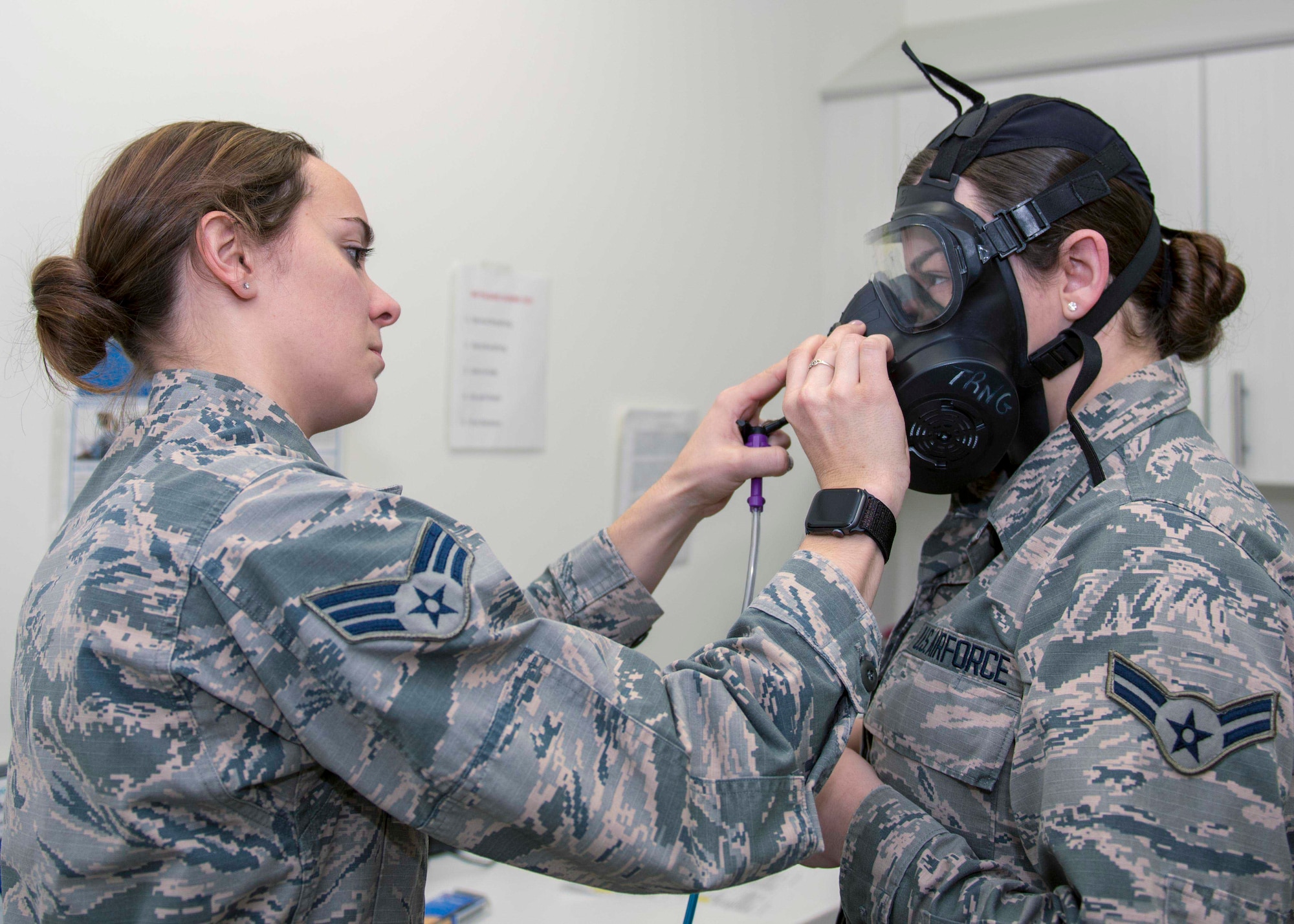 Senior Airman Mary Hicks, 4th Operational Medical Readiness Squadron bioenvironmental engineering journeyman, prepares to administer a gas mask fit test on, Airman 1st Class Cassandra Hart, 704th Aircraft Maintenance Squadron personnel apprentice, Jan. 23, 2020, at Seymour Johnson Air Force Base, N.C.