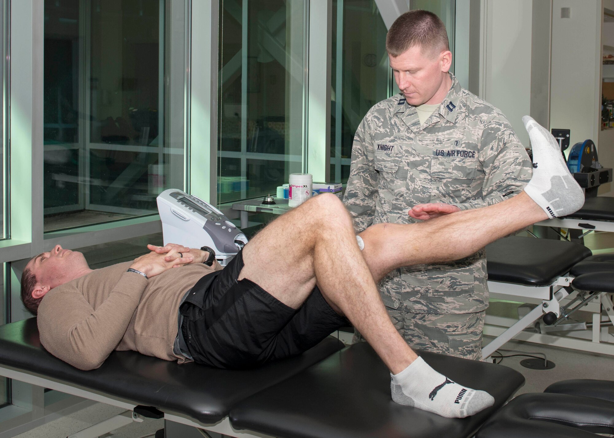 Capt. Ryan Knight, 4th Operational Medical Readiness Squadron physical therapist, preforms neuromuscular electrical stimulation (NMES) on, Maj. Dusten Weathers, 334th Flight Squadron assistant director of operations, Jan. 29, 2019, at the Thomas Koritz Clinic on Seymour Johnson Air Force Base, N.C.