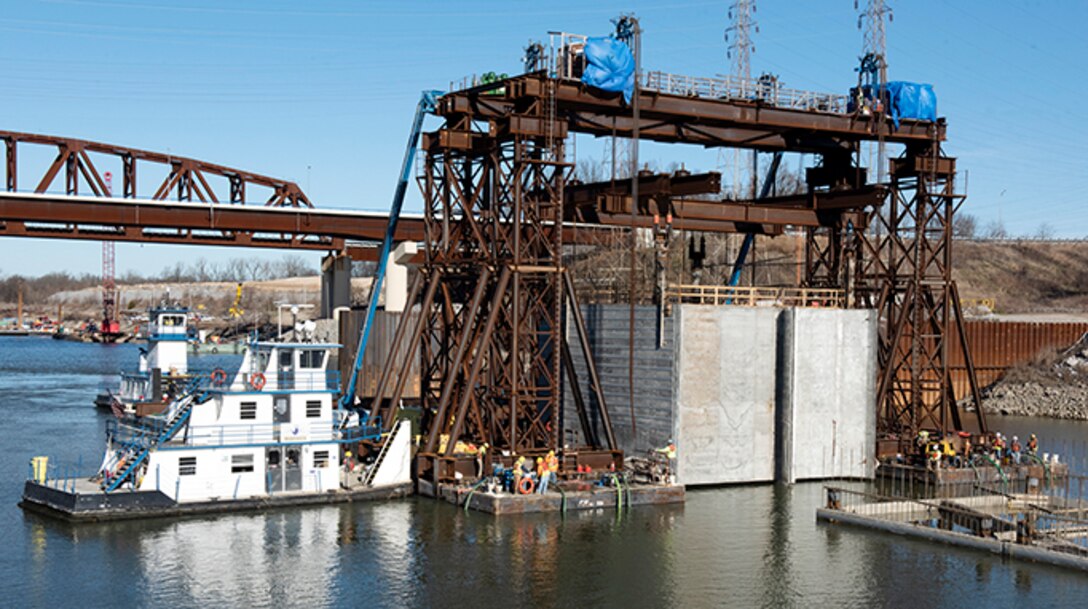 The U.S. Army Corps of Engineers Nashville District and contractor Johnson Brothers place the final concrete shell on the riverbed of the Tennessee River Feb. 2, 2020 below Kentucky Lock in Grand Rivers, Ky. It is the 10th concrete shell that is part of the permanent downstream lock wall and will double as part of a coffer dam for the Kentucky Lock Addition Project. (USACE photo by Lee Roberts)