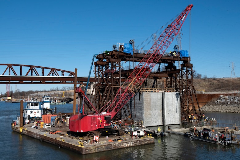 The U.S. Army Corps of Engineers Nashville District and contractor Johnson Brothers place the final concrete shell on the riverbed of the Tennessee River Feb. 2, 2020 below Kentucky Lock in Grand Rivers, Ky. It is the 10th concrete shell that is part of the permanent downstream lock wall and will double as part of a coffer dam for the Kentucky Lock Addition Project. (USACE photo by Lee Roberts)