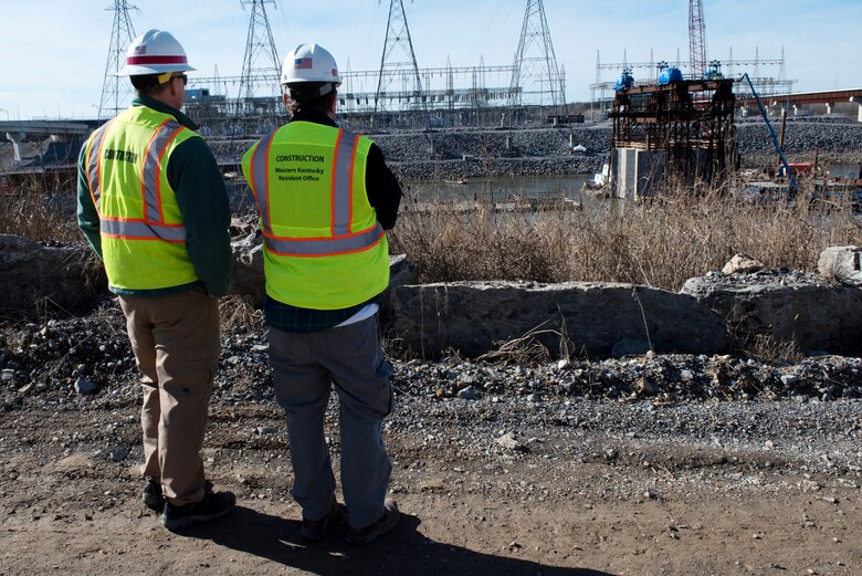 Don Getty (Right), U.S. Army Corps of Engineers Nashville District project manager for the Kentucky Lock Addition Project, and Barney Schulte, the project’s lead engineer, monitor the progress of the placement of the final concrete shell on the riverbed of the Tennessee River Feb. 2, 2020 below Kentucky Lock in Grand Rivers, Ky. The Corps and contractor, Johnson Brothers, placed the 10th concrete shell that is part of the permanent downstream lock wall and will double as part of a coffer dam for the Kentucky Lock Addition Project. (USACE photo by Lee Roberts)