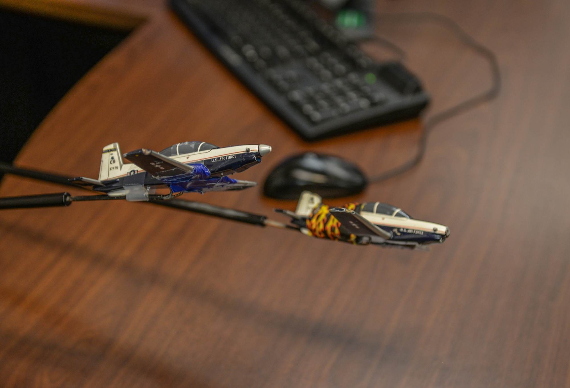 Two model T-6 Texan IIs being demonstrated by 1st Lt. Alexandra Taylor, 37th Flying Training Wing instructor pilot, as a type of flying formation, Jan. 27, 2020, at Columbus Air Force Base, Mississippi. The smallest flying formation is called a section, consisting of two aircraft side by side (U.S. Air Force photo by Airman Davis Donaldson)