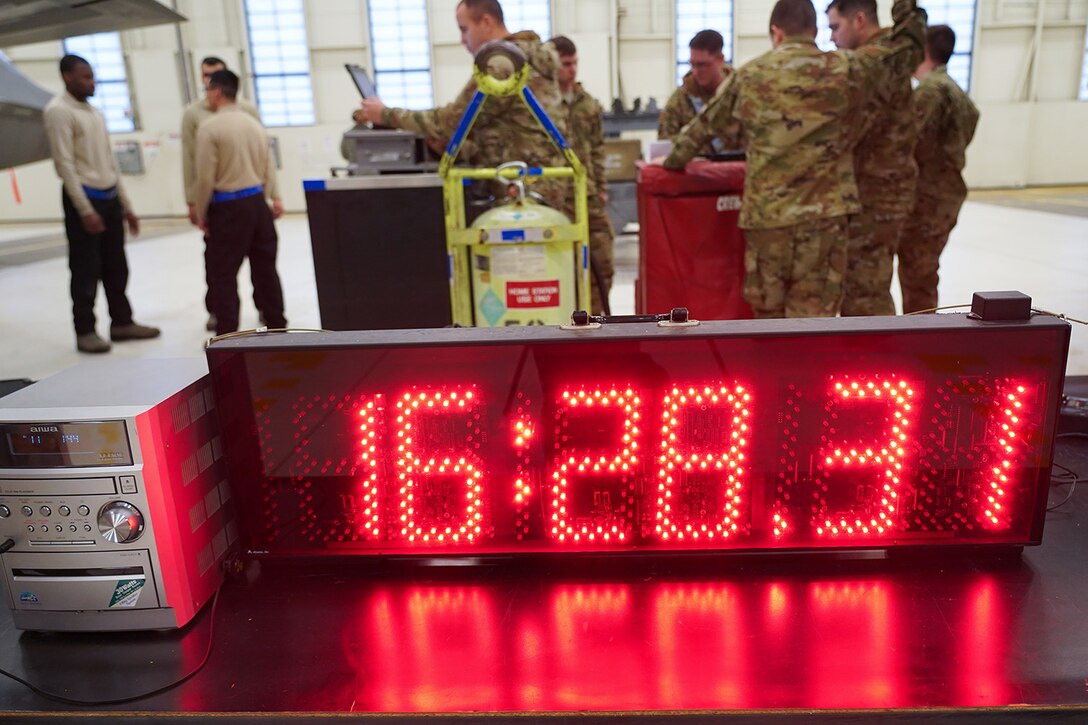 Airmen assigned to the 90th and 525th Aircraft Maintenance Units compete during a timed F-22 Raptor load crew competition on Joint Base Elmendorf-Richardson, Alaska, Jan. 31, 2020.