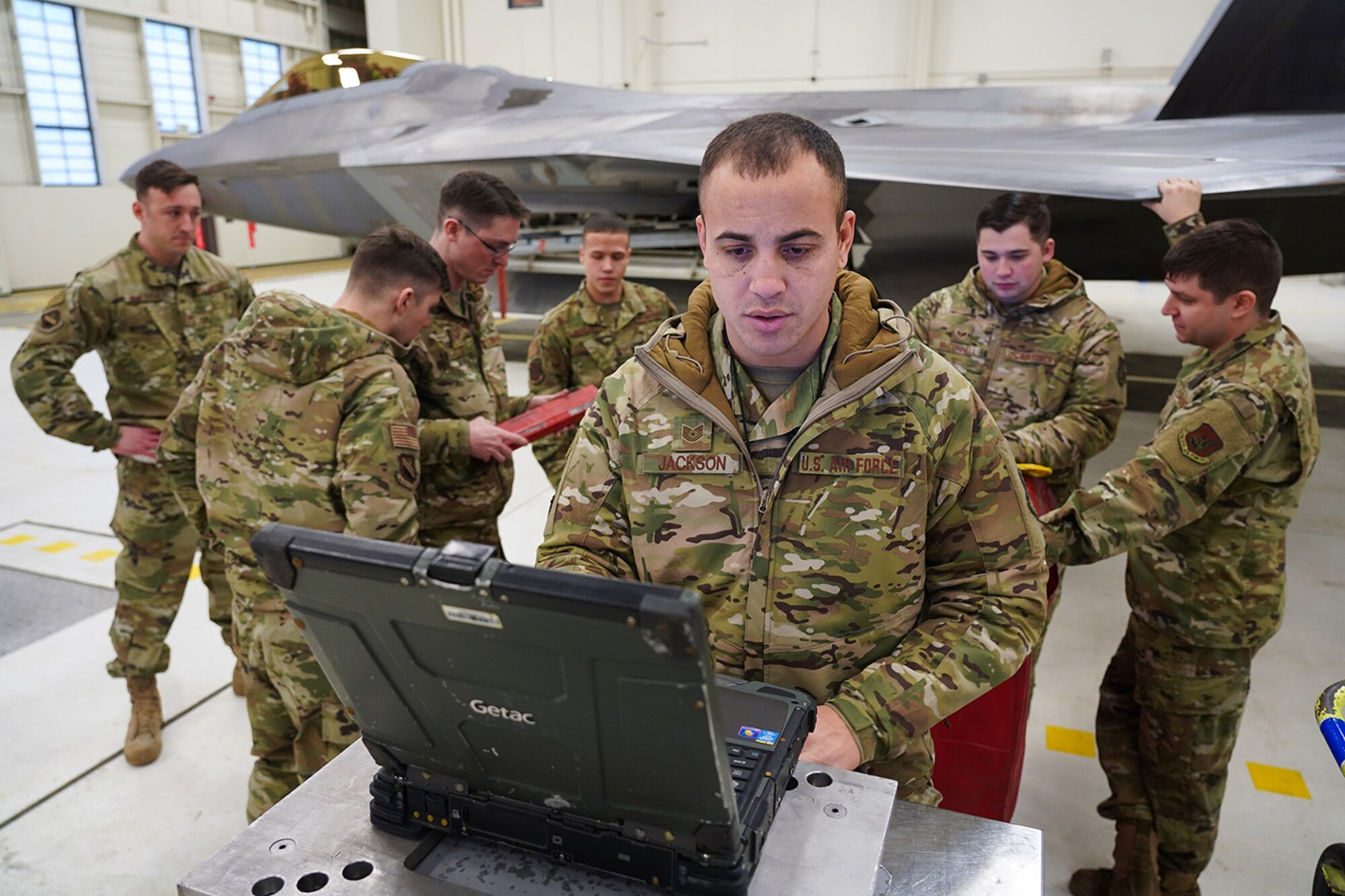 Airmen assigned to the 90th and 525th Aircraft Maintenance Units compete during a timed F-22 Raptor load crew competition on Joint Base Elmendorf-Richardson, Alaska, Jan. 31, 2020.