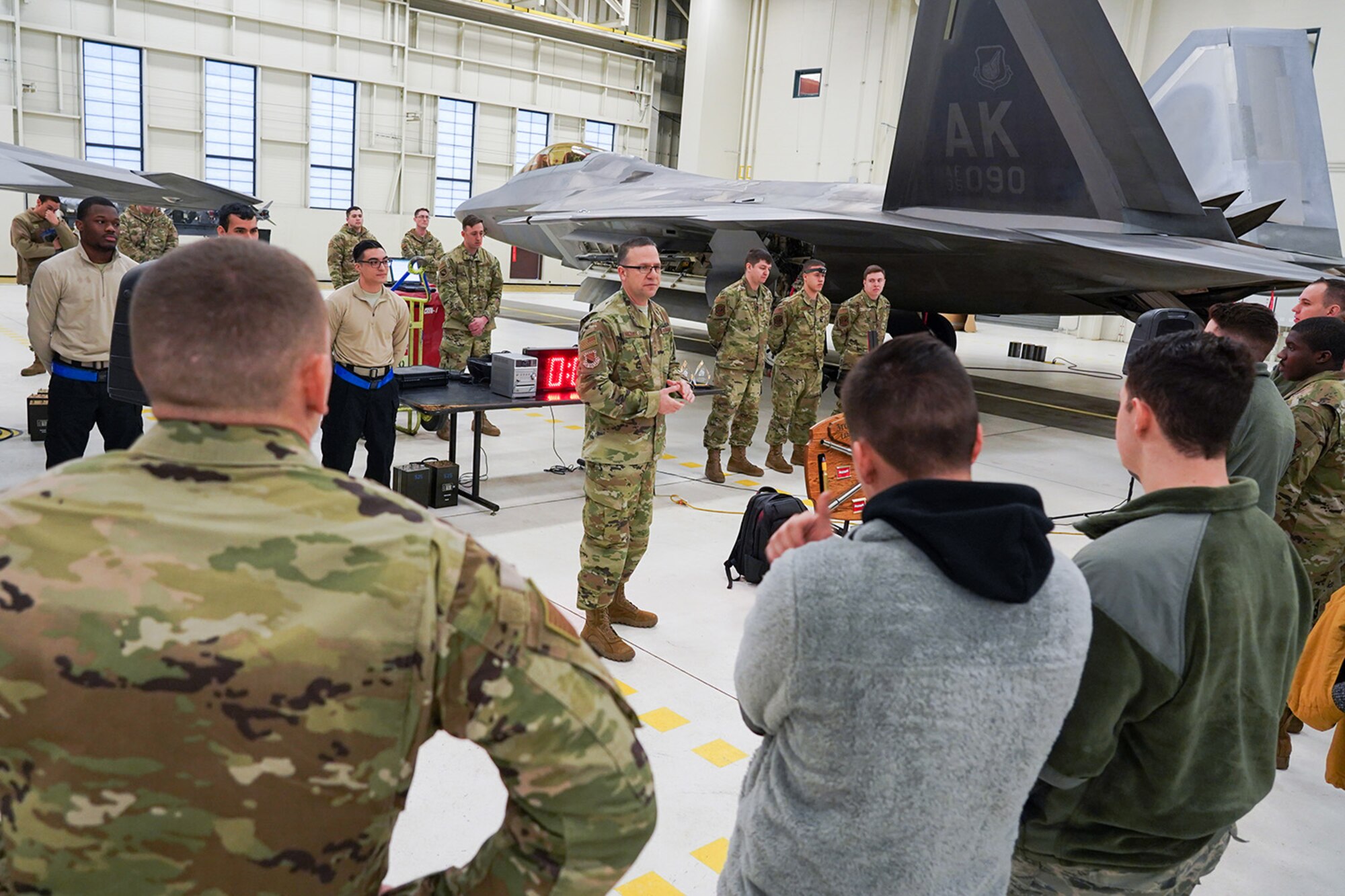 Airmen assigned to the 90th and 525th Aircraft Maintenance Units compete during a timed F-22 Raptor load crew competition on Joint Base Elmendorf-Richardson, Alaska, Jan. 31, 2020.