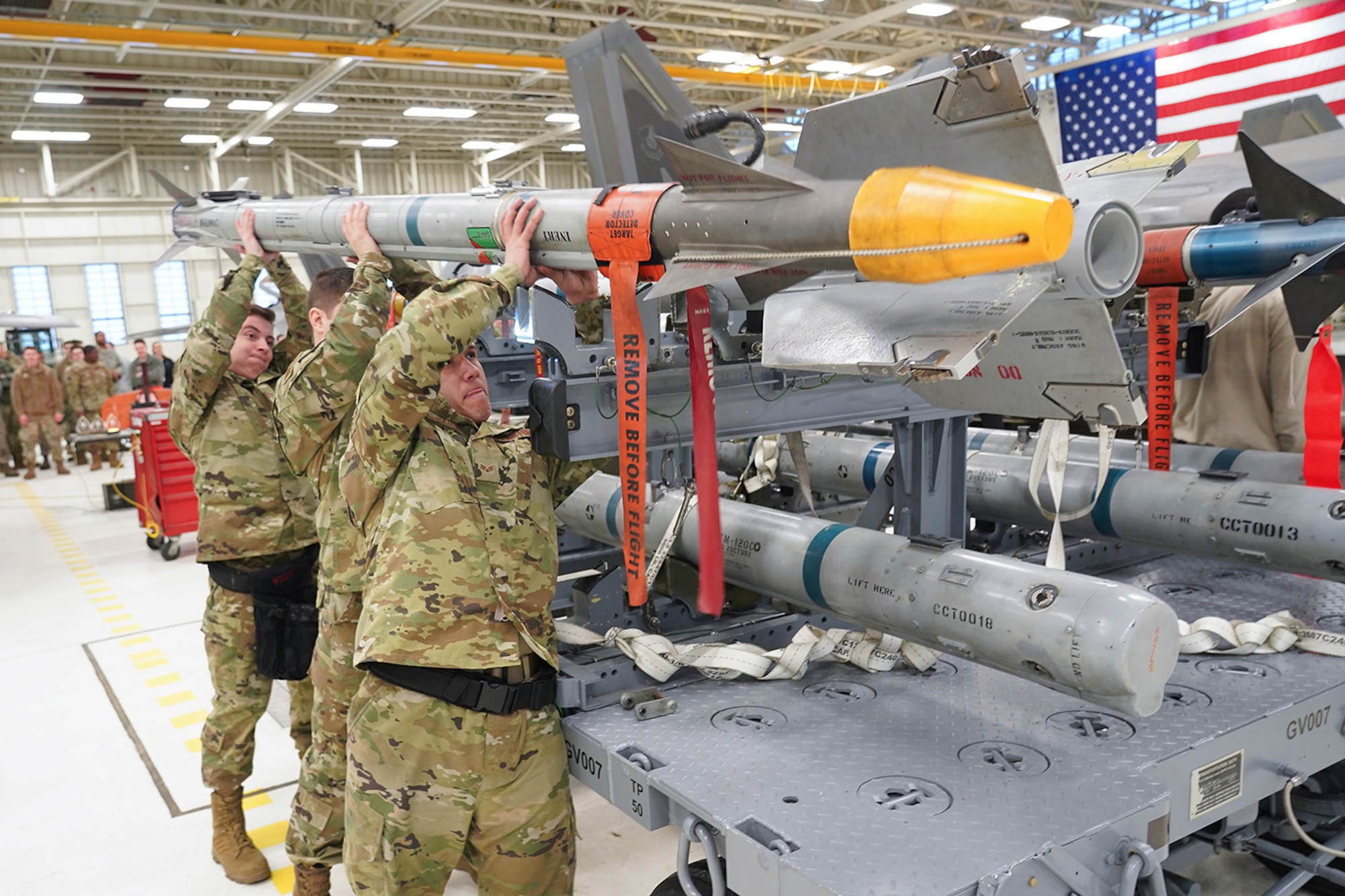 Airmen assigned to the 90th and 525th Aircraft Maintenance Units compete during a timed F-22 Raptor load crew competition on Joint Base Elmendorf-Richardson, Alaska, Jan. 31, 2020.
