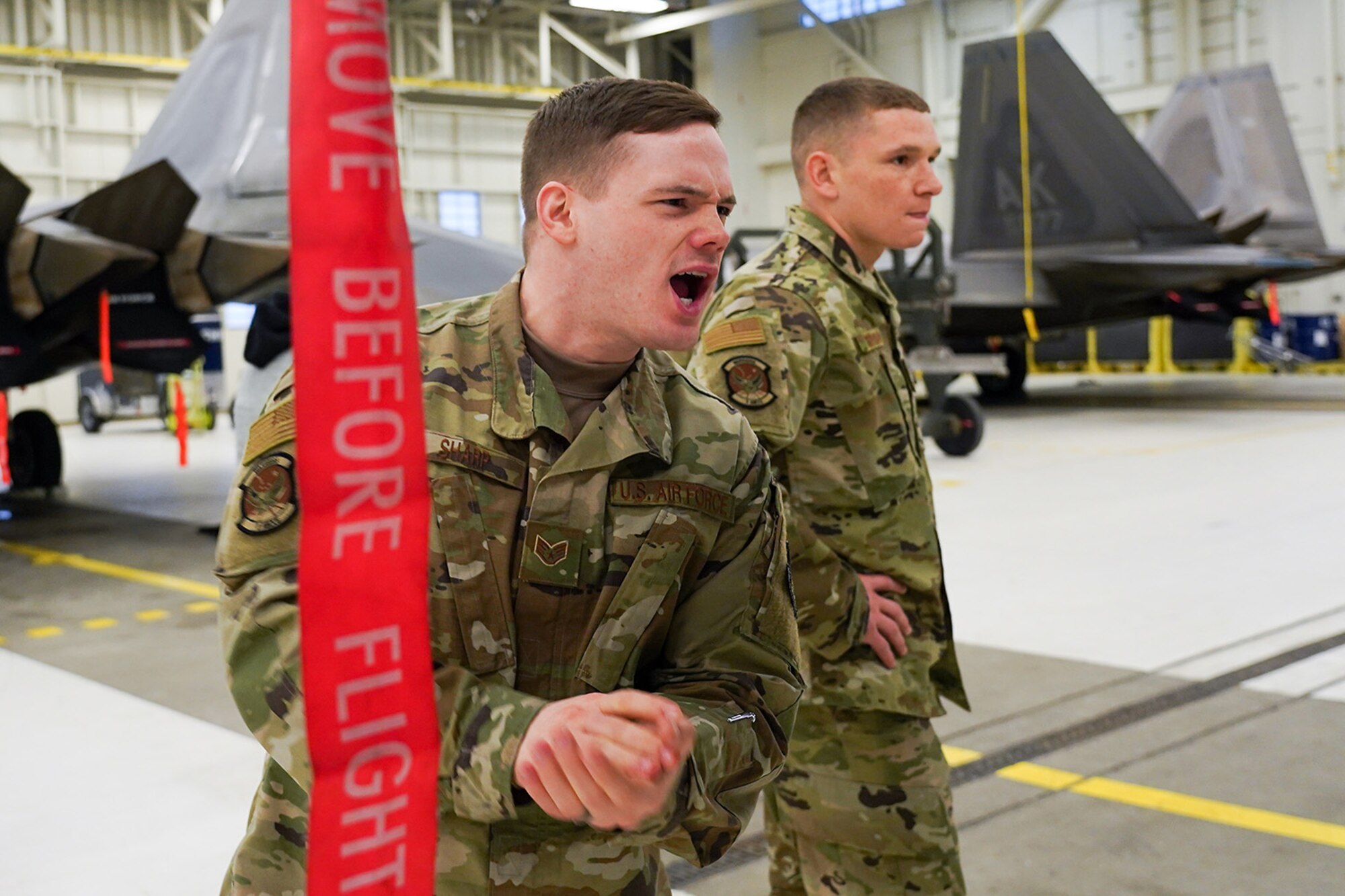 Airmen assigned to the 90th and 525th Aircraft Maintenance Units compete during a timed F-22 Raptor load crew competition on Joint Base Elmendorf-Richardson, Alaska, Jan. 31, 2020.