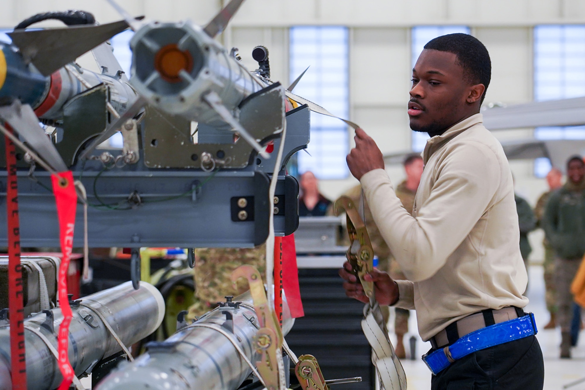 Airmen assigned to the 90th and 525th Aircraft Maintenance Units compete during a timed F-22 Raptor load crew competition on Joint Base Elmendorf-Richardson, Alaska, Jan. 31, 2020.