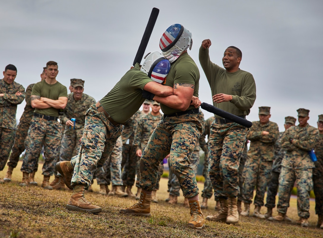 U.S. Marines with Marine Forces Reserve execute baton fighting techniques during the King of the Ring tournament at Marine Corps Support Facility New Orleans, Jan. 31, 2020. The MFR King of the Ring tournament is a competition that involves knife fighting, grappling and baton fighting. (U.S. Marine Corps photo by Lance Cpl. Leslie Alcaraz)