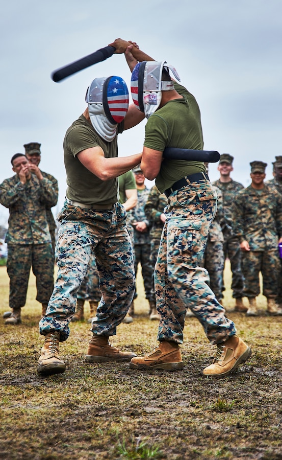U.S. Marines with Marine Forces Reserve execute baton fighting techniques during the King of the Ring tournament at Marine Corps Support Facility New Orleans, Jan. 31, 2020. The tournament challenges competitors to three categories of knife fighting, grappling and baton fighting to become the overall King of the Ring champion. (U.S. Marine Corps photo by Lance Cpl. Leslie Alcaraz)