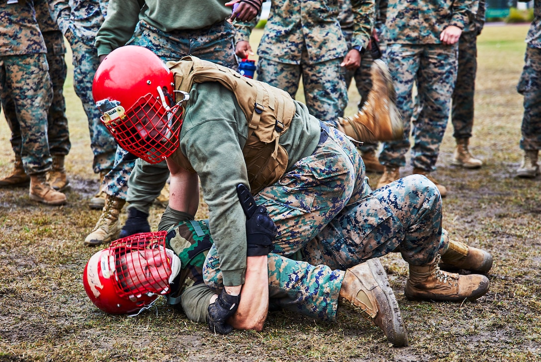 U.S. Marines with Marine Forces Reserve execute knife fighting techniques during the King of the Ring tournament at Marine Corps Support Facility New Orleans, Jan. 31, 2020. The tournament challenges competitors to three categories of knife fighting, grappling and baton fighting to become the overall King of the Ring champion. (U.S. Marine Corps photo by Lance Cpl. Leslie Alcaraz)