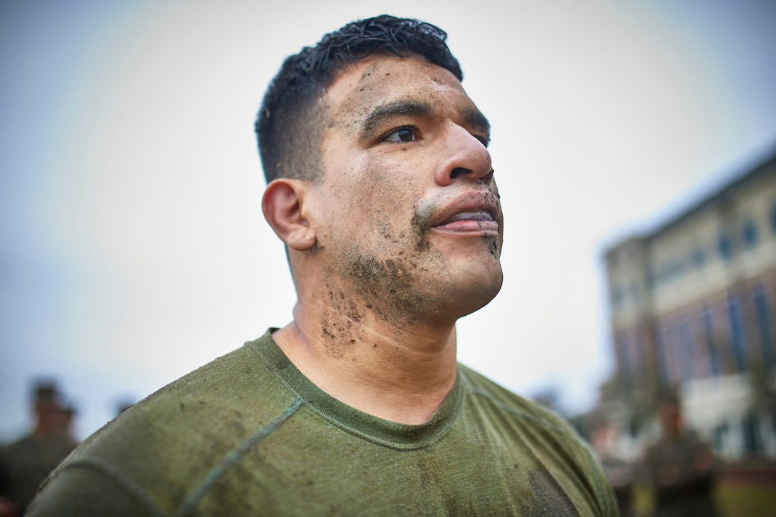 Sgt. Edgardo Quesada, an aviation supply specialist with 4th Marine Aircraft Wing takes a break from grappling during the King of the Ring tournament at Marine Corps Support Facility New Orleans, Jan. 31, 2020.The tournament challenges competitors to three categories of knife fighting, grappling and baton fighting to become the overall King of the Ring champion. (U.S. Marine Corps photo by Lance Cpl. Leslie Alcaraz)