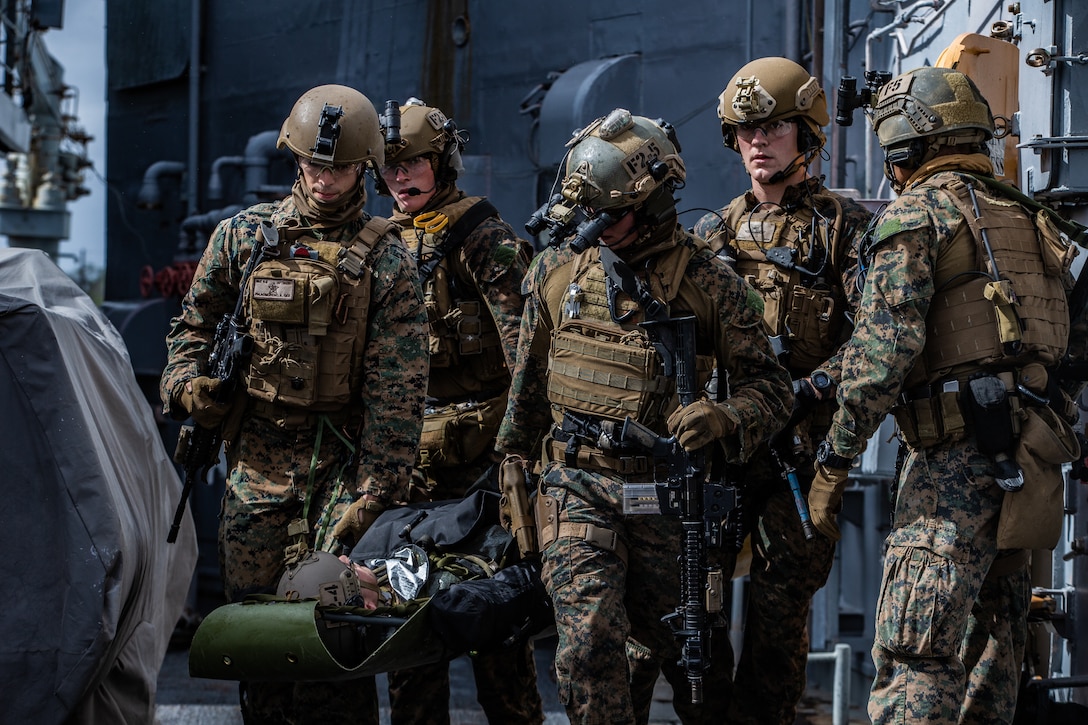 Marines and Sailors secure a simulated casualty during Visit, Board, Search and Seizure training in Pearl Harbor, Hawaii, Jan. 10.