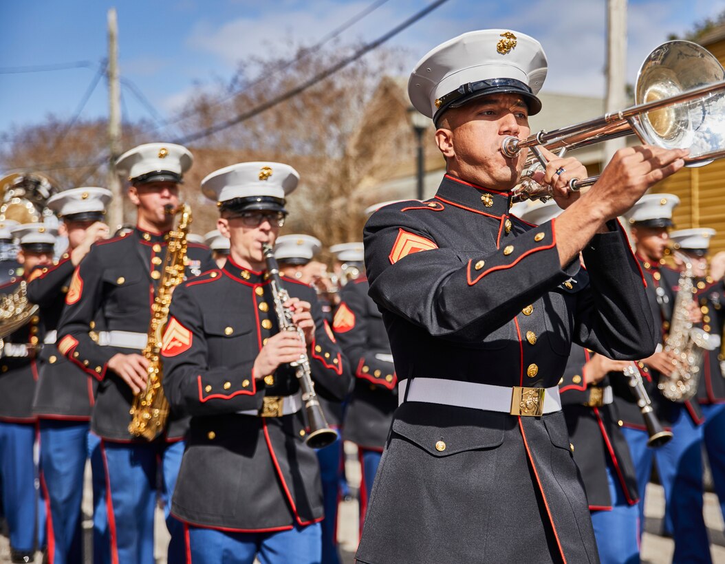 U.S. Marine Corps band members with the Marine Forces Reserve Band march toward the stage during the Algiers Festival 2020 in Federal City, New Orleans, Feb. 1, 2020. The band performed to show their support towards the New Orleans community and kicked off the Algiers Festival 2020. (U.S. Marine Corps photo by Lance Cpl. Leslie Alcaraz)
