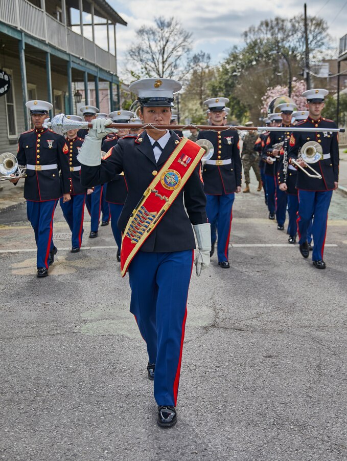 Sgt. Maria Dewey, assistant drum major with the Marine Forces Reserve Band, leads the band at the Algiers Festival 2020 in Federal City, New Orleans, Feb. 1, 2020. The band performed to show their support towards the New Orleans community and kicked off the Algiers Festival 2020. (U.S. Marine Corps photo by Lance Cpl. Leslie Alcaraz)