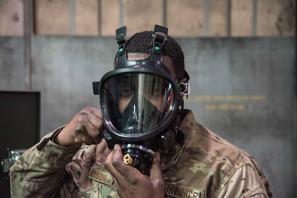 U.S. Air Force Master Sgt. Eugene Jackson of the 166th Maintenance Squadron, fuel systems maintenance shop, demonstrates a supplied air respirator used by fuel cell maintainers Nov. 26, 2019.