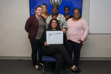 Some of the Federal Women's Program key board members with NNSY’s certificate for receiving a silver rating: Waterfront Ombudsman Danielle Smith, Michelle Johnson, Public Relations Co-Chair Phyllis Scoggins, Public Relations Chair Ashley Chew, Vice President Aiya Williams, and President Carlynn Lucas.