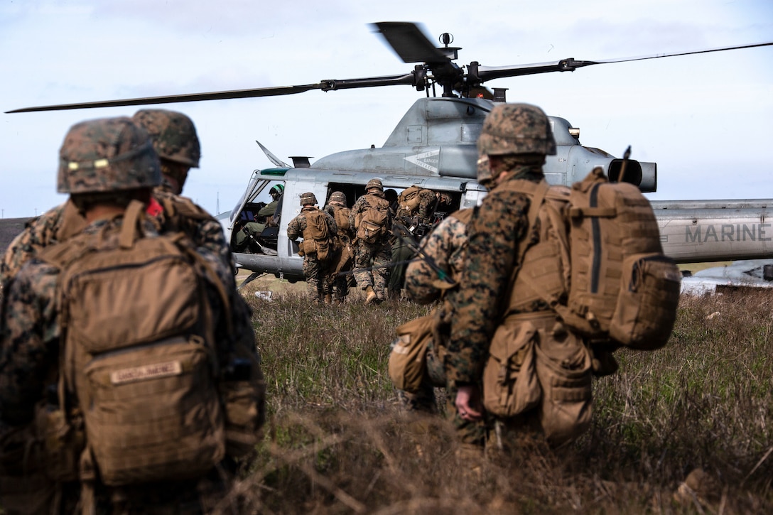U.S. Marines embark on to a UH-1Y Venom with Marine Light Attack Helicopter Squadron 469, Marine Aircraft Group 39, 3rd Marine Aircraft Wing, for extraction from a landing zone during Exercise Venom Storm on San Clemente Island, Calif., Jan. 15.