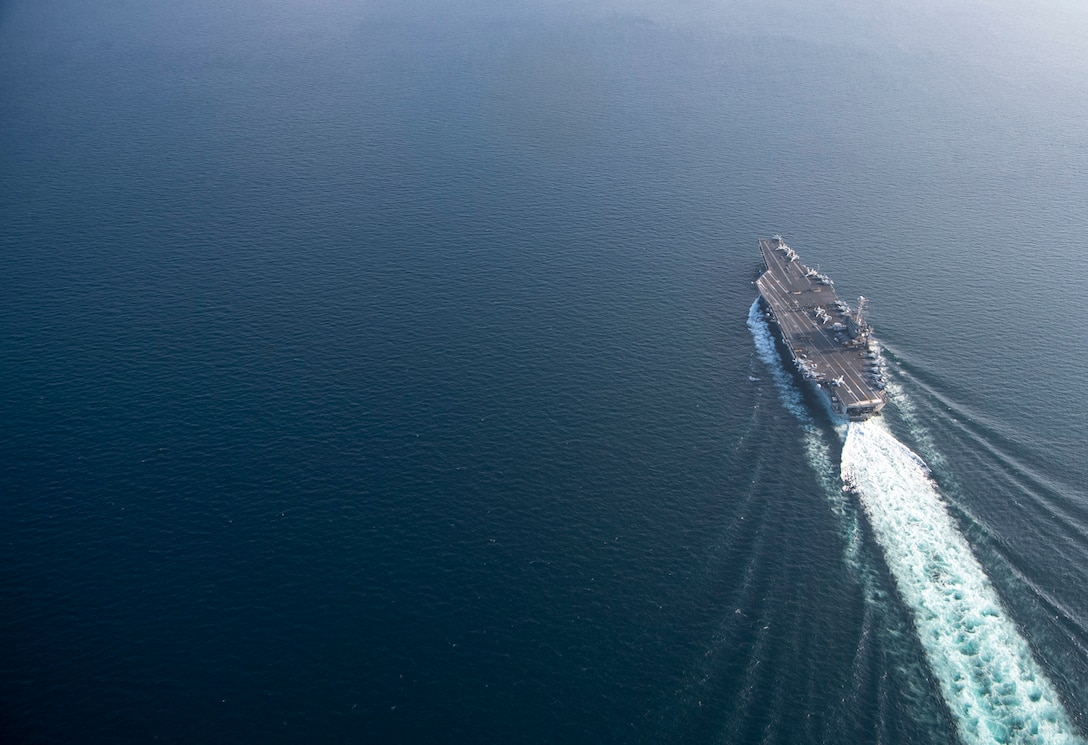 A ship moves through the waters.