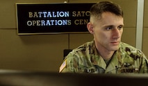 Staff Sgt. Matthew Felker, Headquarters and Headquarters Company, 53rd Signal Battalion, oversees his troops as they work in the new Battalion Satellite Communications Operations Center at Fort Carson, Colorado, as part of the U.S. Army Satellite Operations Brigade. (U.S. Army photo by Sgt. Dennis DePrisco)