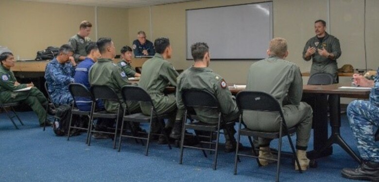 ACANDERSEN AIR FORCE BASE, Guam (Jan. 30, 2020)
Service members from the U.S Navy, Royal Australian Air Force (RAAF), Japan Maritime Self Defense Force (JMSDF), the Republic of Korea Navy (ROKN) and the Royal New Zealand Air Force (RNZAF) attend the Sea Dragon out chop, the final meeting of the exercise, to conclude operation SEA DRAGON 2020, Jan. 30. Sea Dragon is a multi-lateral Anti-Submarine Warfare exercise that improves the interoperability elements required to effectively and cohesively respond to the defense of a regional contingency in the Indo- Pacific, while continuing to build and strengthen relationships held between nations.