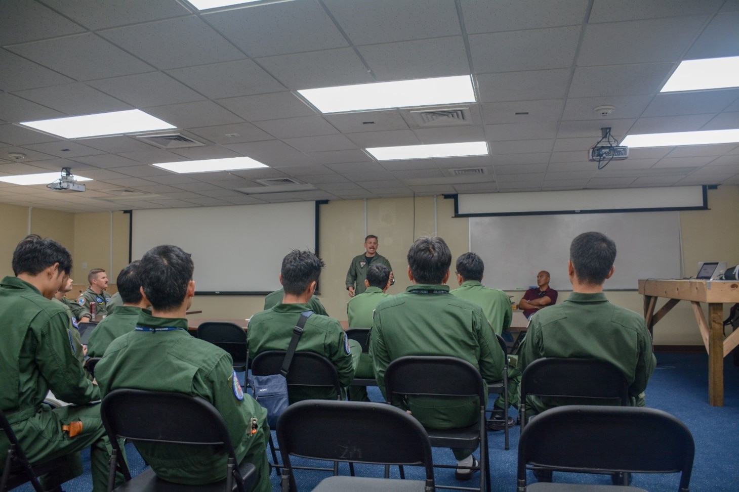 ANDERSEN AIR FORCE BASE, Guam (Jan. 28, 2020) - Service members from the U.S Navy, Japan Maritime Self Defense Force (JMSDF), the Republic of Korea Navy (ROKN) and the Royal New Zealand Navy (RNZN) attend a mission planning brief for operation Sea Dragon, Jan. 28. Sea Dragon is a multi-lateral anti-submarine warfare exercise that improves the interoperability elements required to effectively and cohesively respond to the defense of a regional contingency in the Indo- Pacific, while continuing to build and strengthen relationships held between nations.