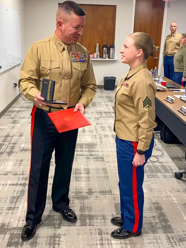 Major General James W. Bierman, Jr., commanding general of Marine Corps Recruiting Command, recognizes Sgt. Nichole Anunciacion, Marketing and Communication Marine, Recruiting Station San Francisco, 12th Marine Corps District, as the MCRC Marketing and Communication Marine of the Year during an award ceremony at Wunderman Thompson, Atlanta, Ga., February 4, 2020. Annually, MCRC selects one Recruiting Station Marketing and Communication Marine as the MAC of the year, from six Marine Corps Districts. (U.S. Marine Corps Photo by 2nd Lt. Mallory S. VanderSchans)