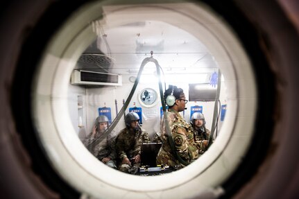 Senior Airman Deaja Ellis, 359th Aerospace Medicine Squadron aerospace and operational physiology technician, instructs aviators-in-training on correct oxygen mask procedures Jan. 28, 2020 at Joint Base San Antonio-Randolph, Texas. Members of the aerospace and operational physiology training unit use a hypobaric chamber to teach pilots and aircrew members about the effects of altitude on the human body. (U.S. Air Force photo by Tech. Sgt. Katherine Spessa)