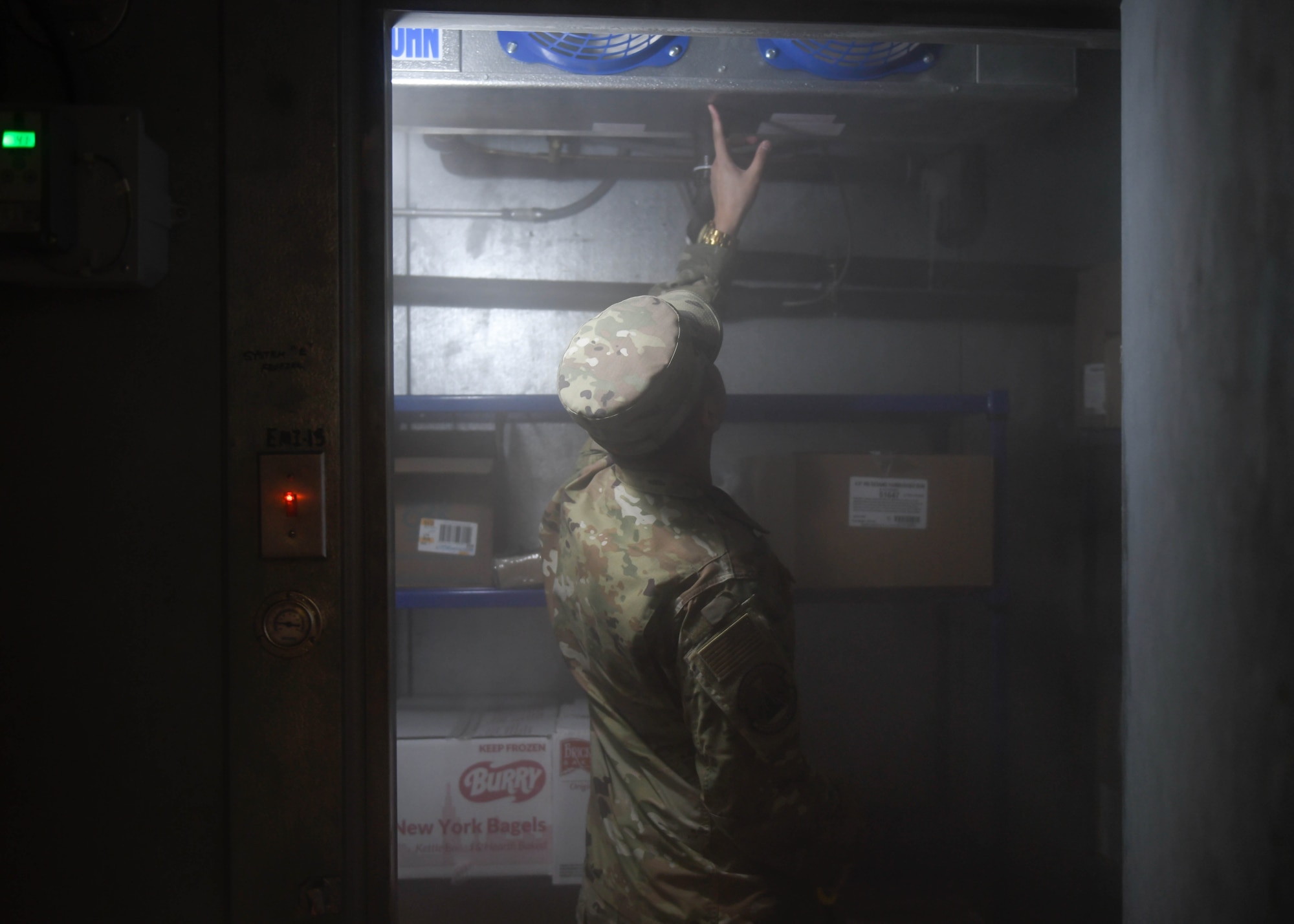 Staff Sgt. Joseph Deguino, 56th Operational Medicine Readiness Squadron Public Health communicable disease noncommissioned officer in charge, examines a freezer during a monthly inspection Jan. 27, 2020, in Club 5/6 at Luke Air Force Base, Ariz. While inspecting the freezer, Deguino looks for debris that could possibly cross-contaminate food. Public health helps keep Airmen healthy, ready to train and deploy by inspecting facilities for food quality, performing audiograms and more. (U.S. Air Force photo by Airman 1st Class by Brooke Moeder)