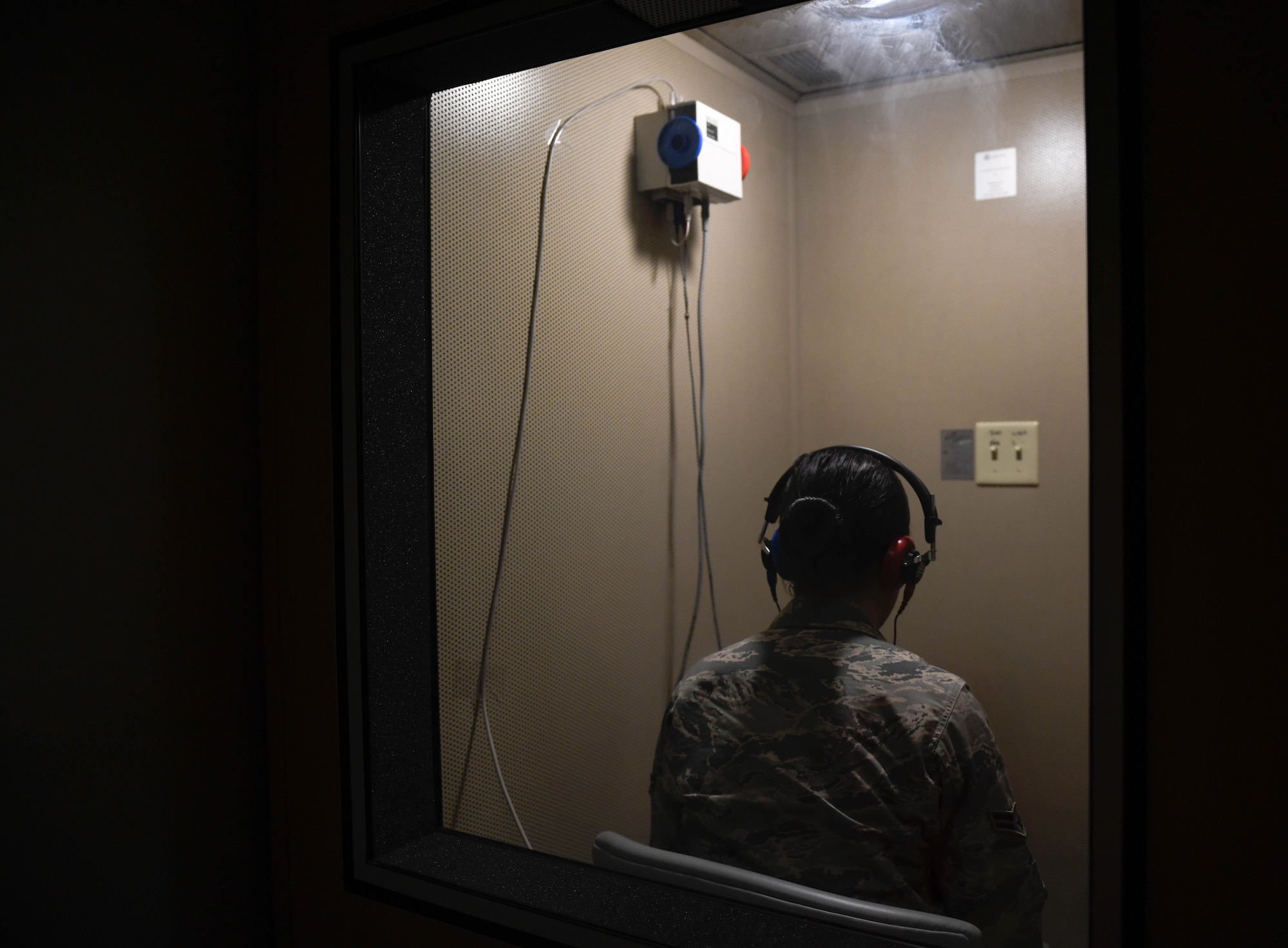 Airman 1st Class Hannah Rios, 56th Operational Medicine Readiness Squadron Public Health technician, receives her annual audiogram test Jan. 28, 2020, at Luke Air Force Base, Ariz. Specialists perform audiograms annually for Airmen who are exposed to loud noises for a long period of time. The Occupational health section performs more than 30 audiograms each day. Public health helps keep Airmen healthy, ready to train and deploy by inspecting facilities for food quality, performing audiograms and more. (U.S. Air Force photo by Airman 1st Class Brooke Moeder)