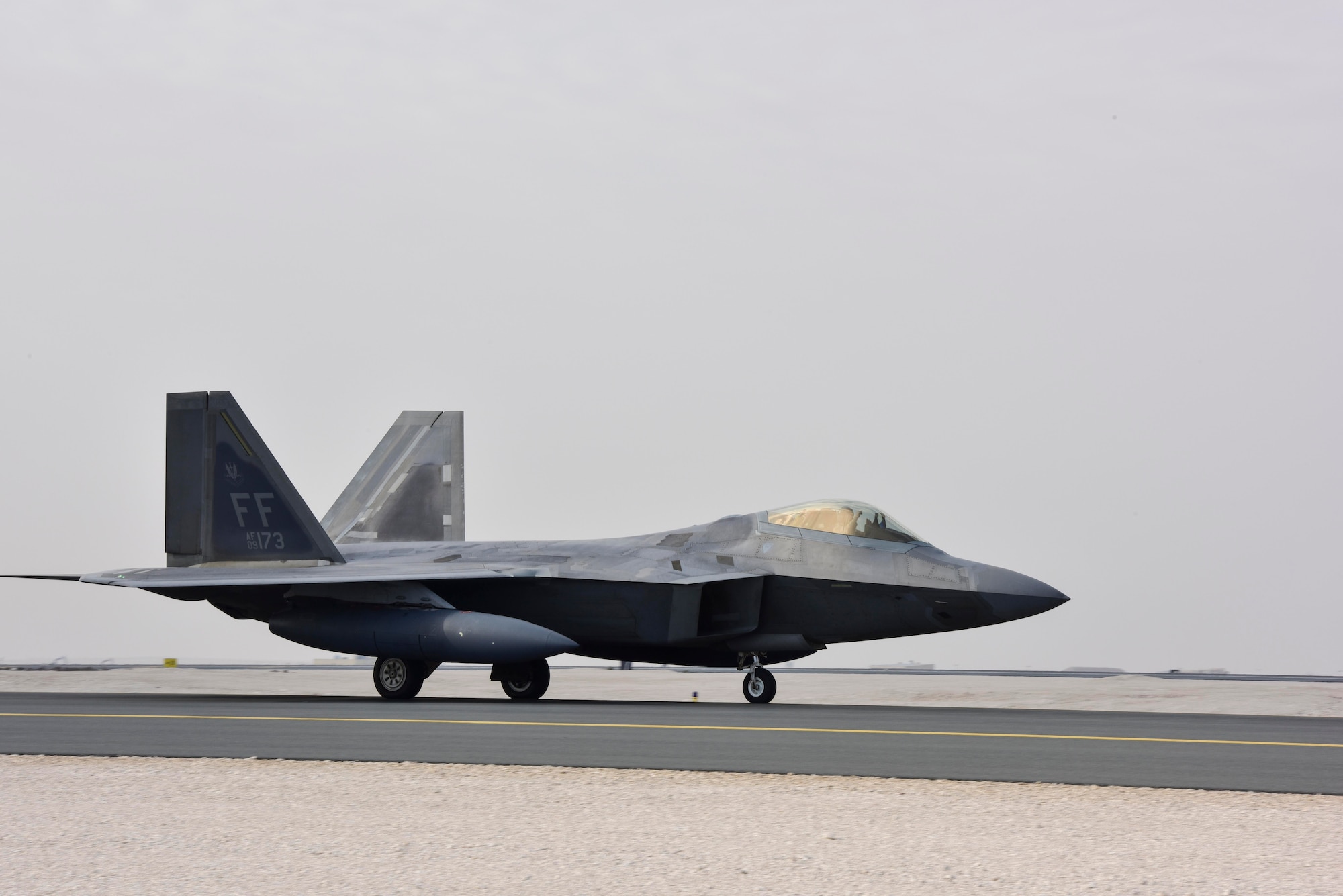 An F-22 Raptor taxis to the runway at Al Udeid Air Base, Qatar on Feb. 1, 2020. The F-22 combines stealth, supercruise, maneuverability, and integrated avionics to provide air superiority throughout the U.S. Air Forces Central Command area of responsibility. (U.S. Air Force photo by Tech. Sgt. John Wilkes)