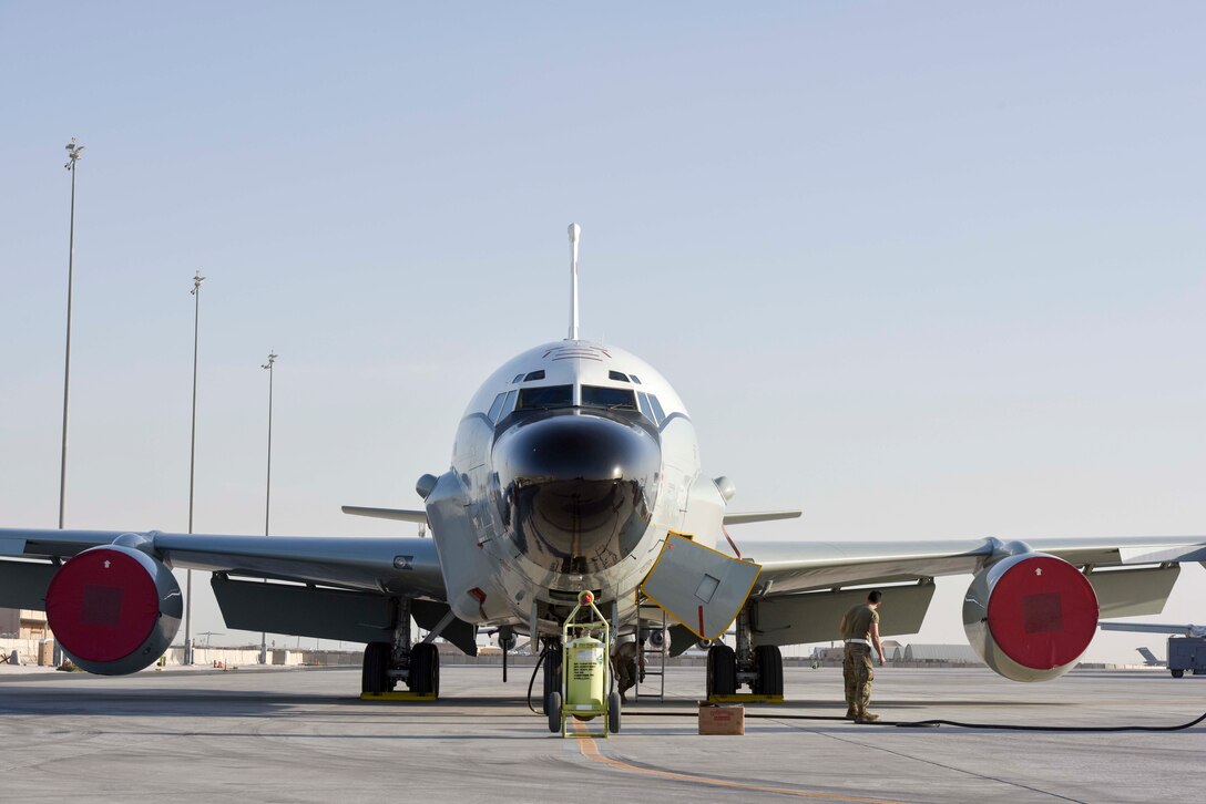 Airmen perform maintenance on an RC-135W Rivet Joint aircraft at Al Udeid Air Base, Qatar on Jan. 30, 2020. The Rivet Joint supports theater and national level consumers with real time intelligence collection, analysis and dissemination capabilities. (U.S. Air Force photo by Tech. Sgt. John Wilkes)