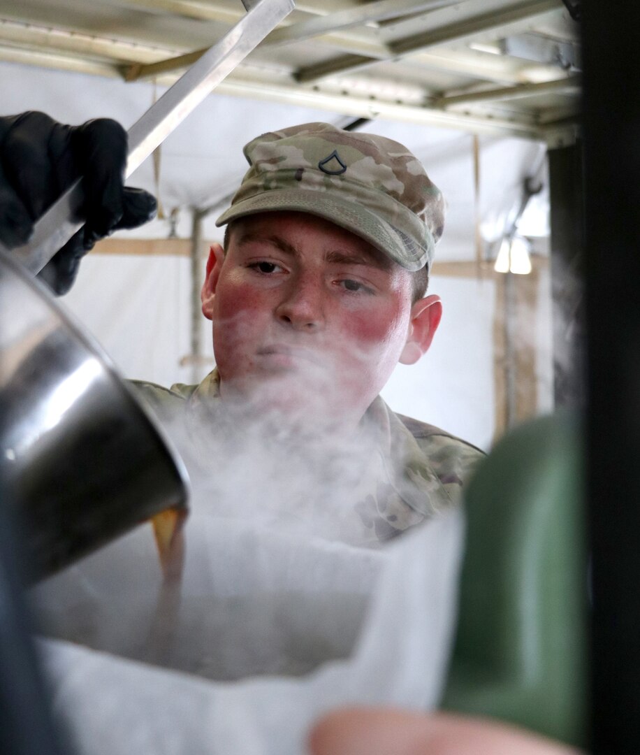 Pfc. Christian Phipps, a culinary specialist with the 109th Multifunctional Medical Battalion, Iowa Army National Guard, pours coffee during the Philip A. Connelly culinary competition at the Iowa City Readiness Center Feb. 1, 2020. Phipps is on the 109th culinary team, which won the state and regional contests and is competing against National Guard units from Nebraska, New York and Virginia for the national title for best culinary operation in the Army National Guard, field-feeding category.