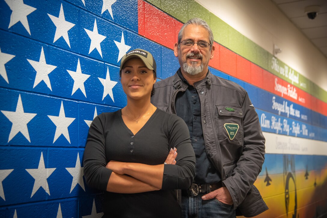 Artist receives DLA Installation Management Cultural Achievement Award for patriotic fitness center mural