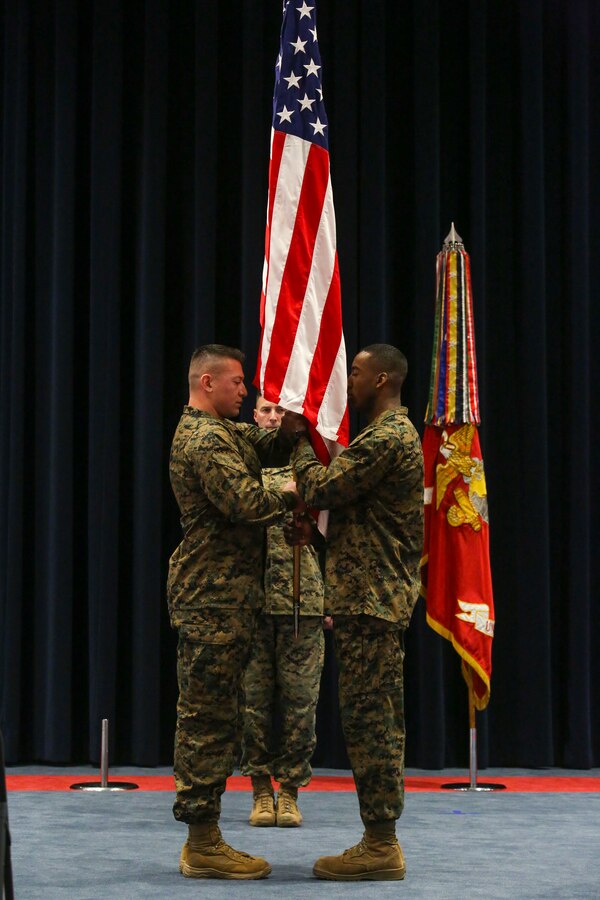 The 39th Color Sergeant of the Marine Corps, Sgt. Franklin D. Taft, left, receives the National Ensign from the 38th Color Sergeant of the Marine Corps, Sgt. Francis S. Frazier, right, during a relief and appointment ceremony at Marine Barracks Washington, D.C., Feb. 4, 2020. The Color Sergeant of the Marine Corps serves as the senior sergeant of the Corps, entrusted with carrying the National Ensign in ceremonies throughout the National Capital Region and across the nation. The Color Sergeant leads the official Color Guard Platoon at MBW at is responsible for training and preparing the Marines for future service in the operating forces. (U.S. Marine Corps photo by Sgt. Robert Knapp/Released)